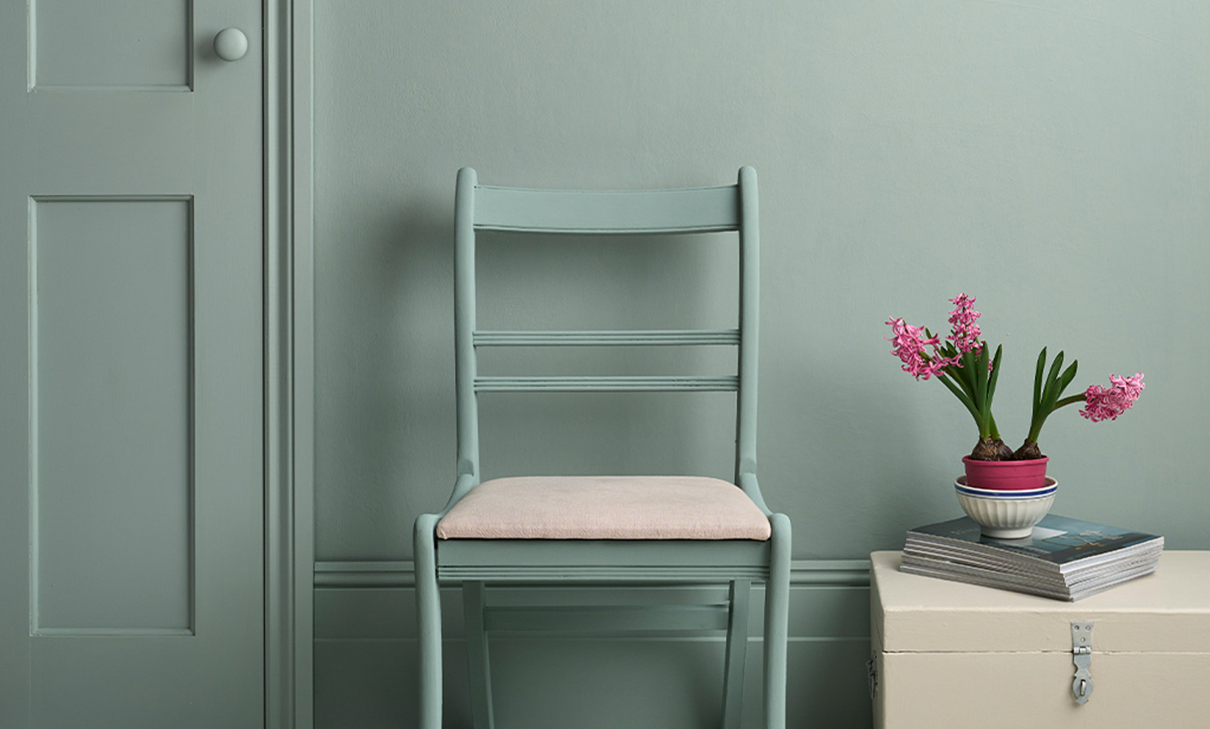 Lifestyle Image of Annie Sloan Satin Paint in Pemberley Blue used on door and skirting