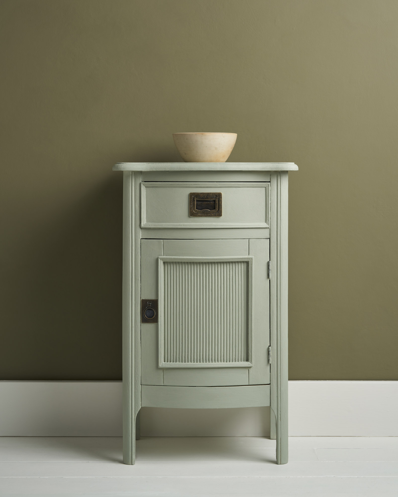 Side Table Painted in Coolabah Green Chalk Paint and Staged against Olive Wall Paint Background