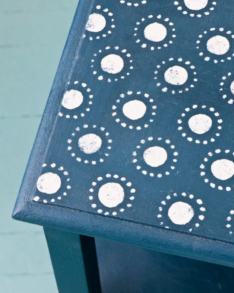 Circles Stencil by Annie Sloan on table painted with Chalk Paint® in Napoleonic Blue with Old White