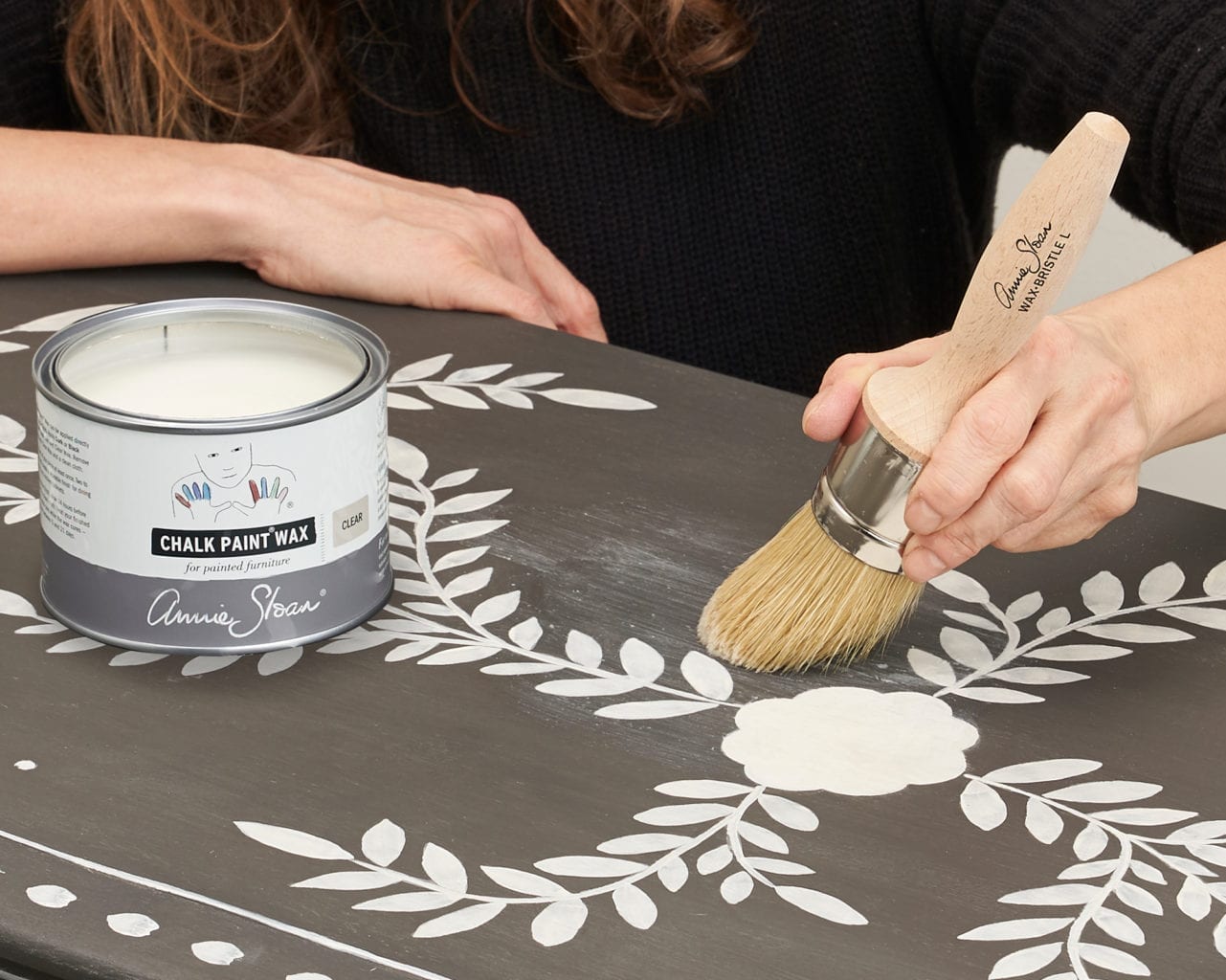 Large Chalk Paint® Wax Brush applying Clear Chalk Paint® Wax to a cabinet
