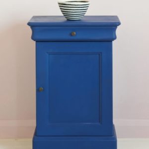 Side table painted with Chalk Paint® in Napoleonic Blue, a rich deep cobalt blue against a pink wall of Antoinette