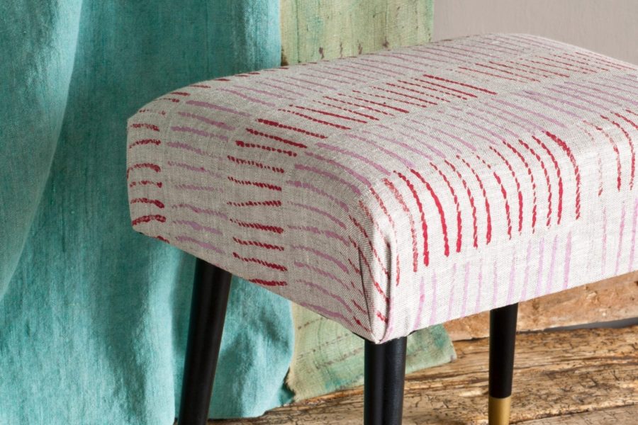 Footstool upholstered with fabric painted with Chalk Paint® furniture paint by Annie Sloan in Emperor's Silk and Henrietta