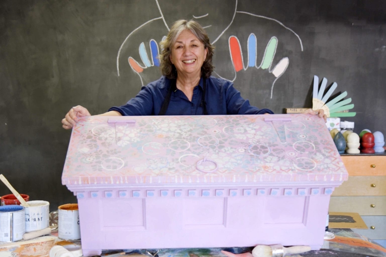 Annie Sloan adding random patterns using Chalk Paint® furniture paint in Henrietta and stencils