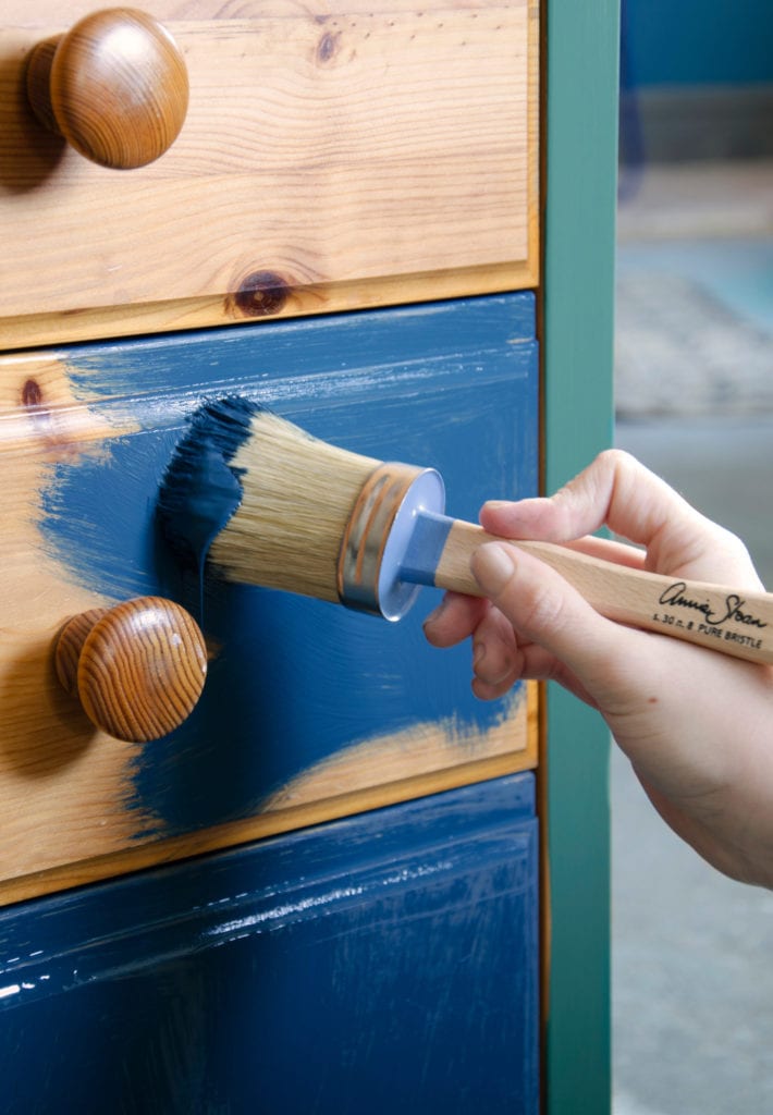 Annie Sloan Chalk Paint Brushes being used with Chalk Paint in Aubusson Blue on a pine side table