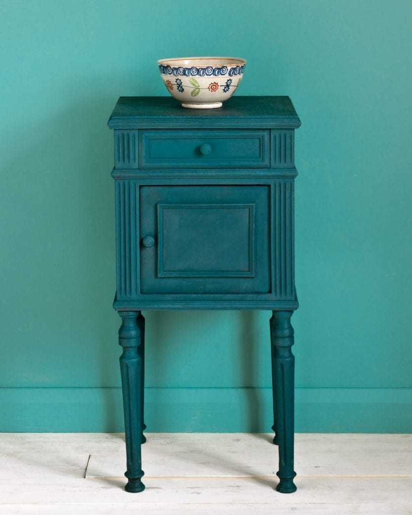 Side table painted with Chalk Paint® in Aubusson Blue, a rich dark classic green-blue teal against a wall of Provence