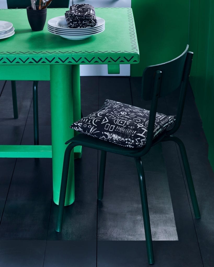 Kitchen table painted with Chalk Paint in Antibes Green and stencilled in Graphite with Valeska Stencil by Annie Sloan. Cushions in Tacit in Graphite fabric.