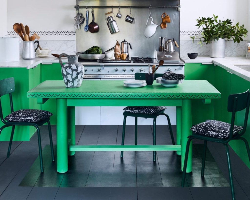 Kitchen table painted with Chalk Paint in Antibes Green and stencilled in Graphite with Valeska Stencil by Annie Sloan. Cushions in Tacit in Graphite fabric.