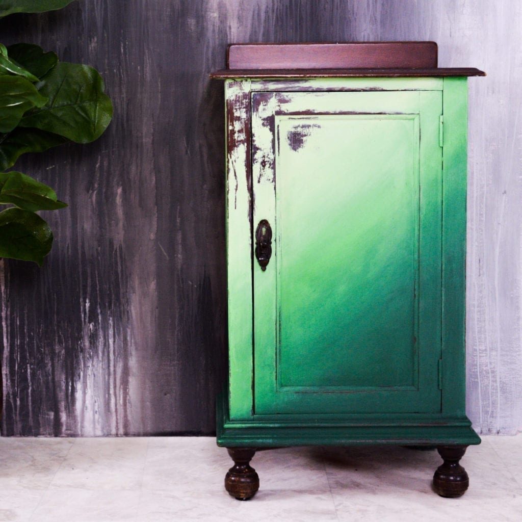 Green ombre distressed cabinet by Annie Sloan Painter in Residence Girl in Blue Designs painted with Chalk Paint® in Amsterdam Green, Antibes Green, and Lem Lem