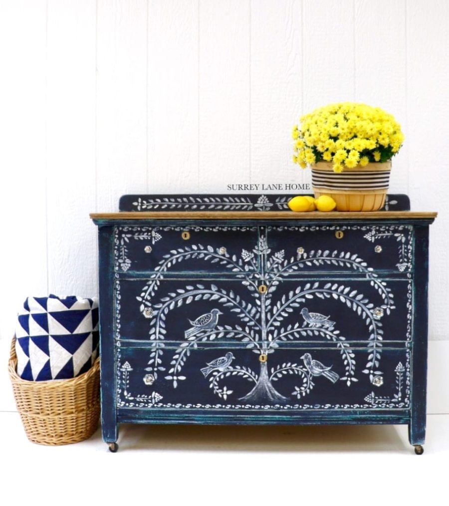 Cabinet painted with Chalk Paint® furniture paint by Annie Sloan in Oxford Navy by Surrey Lane Home, with a folk art design achieved with Detail Brushes