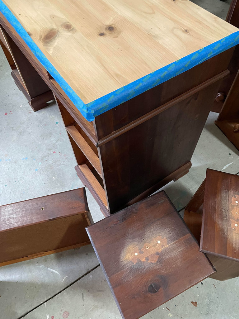 Painter in Residence Olivia Lacy prepping the desk before painting the body with French Linen Chalk Paint®