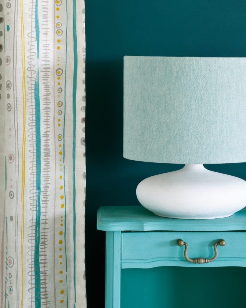 Side table painted with Chalk Paint® in Provence, a light blue-green turquoise against a wall of Aubusson Blue. Piano in Provence curtain and Linen Union in Provence + Old White