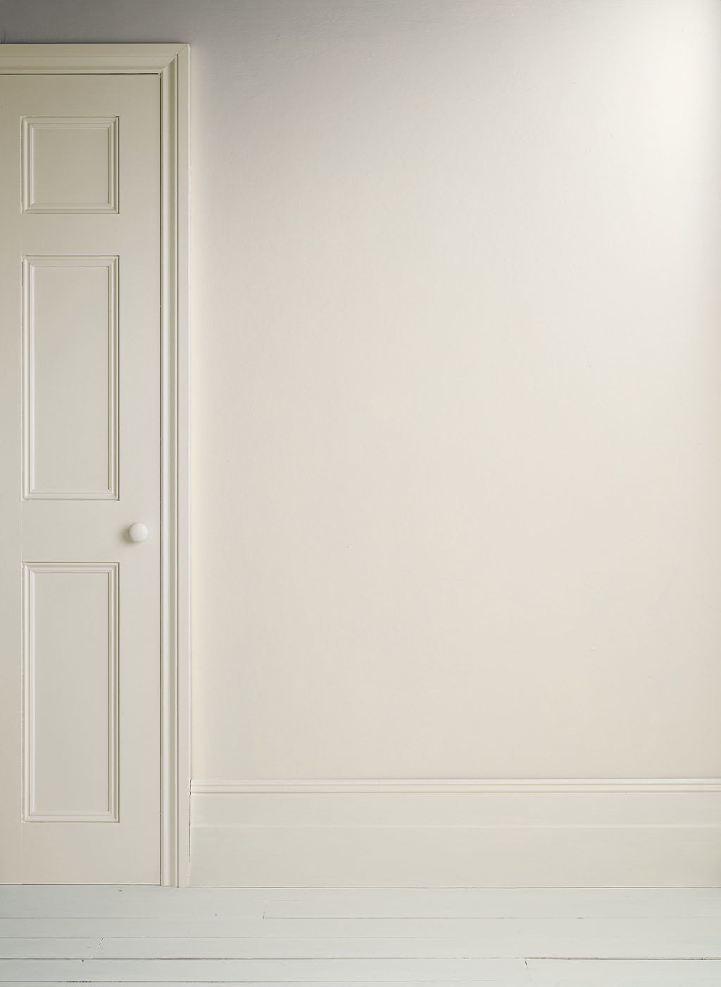 Lifestyle Image of Annie Sloan Satin Paint in Old White featuring painted door and skirting
