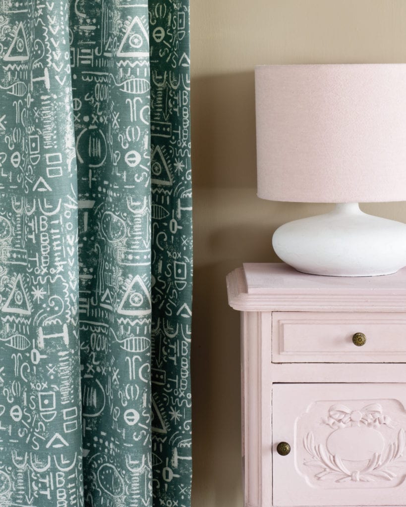 Side table painted with Chalk Paint® in Antoinette, a soft pale pink. Curtain in Tacit in Duck Egg Blue and lampshade in Linen Union in Antoinette + Old White