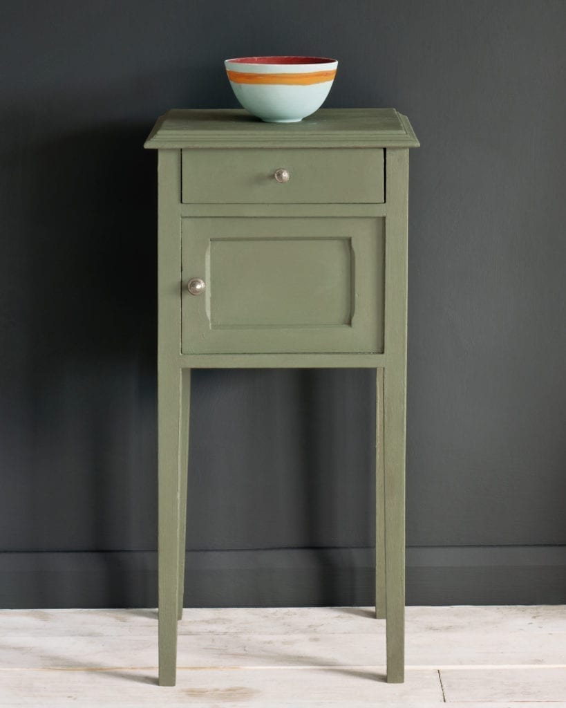 Side table painted with Chalk Paint® in Chateau Grey, an elegant greyed green against a black wall of Graphite.