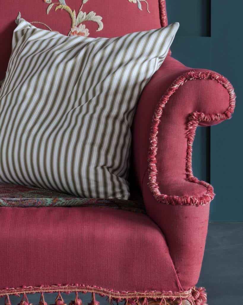 Ticking in Olive fabric by Annie Sloan cushion and vintage red sofa