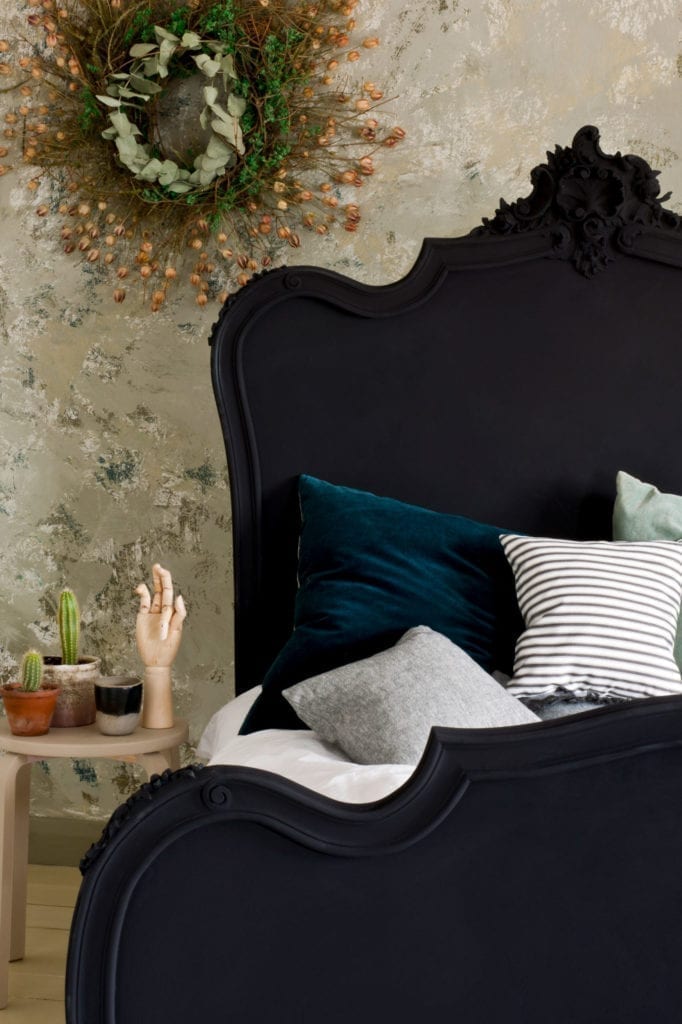 Baroque style bed painted with Chalk Paint® furniture paint by Annie Sloan in Athenian Black, in a textured neutral bedroom scene