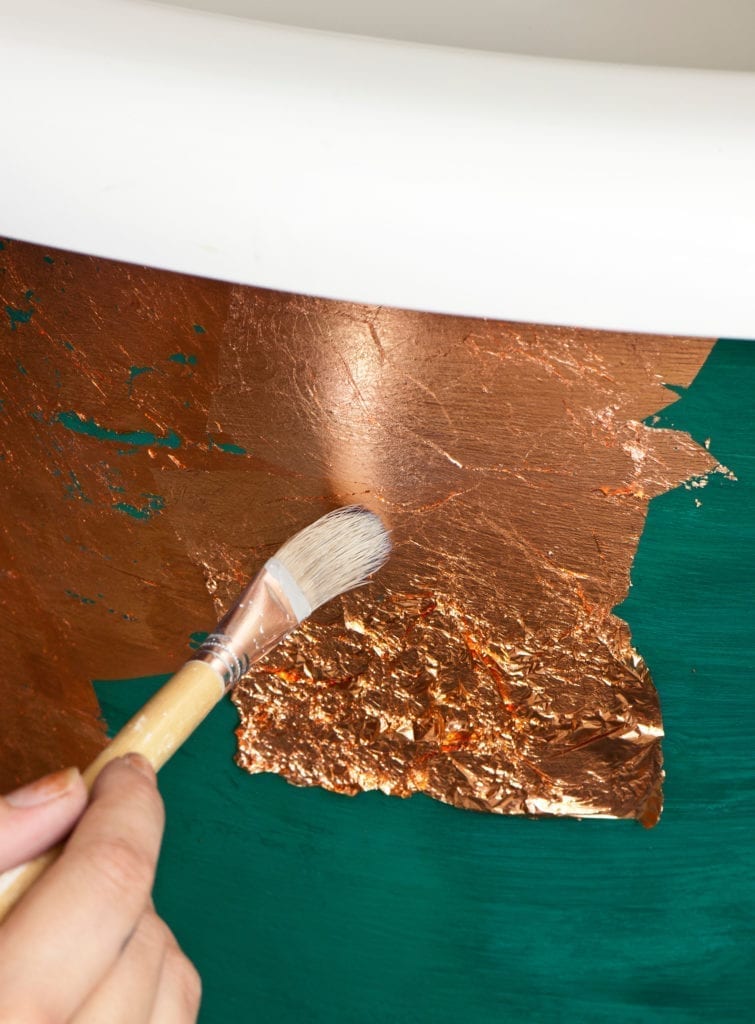 Brass Loose Leaf being applied to a bath painted with Chalk Paint in Florence Credit CICO BOOKS Christopher Drake