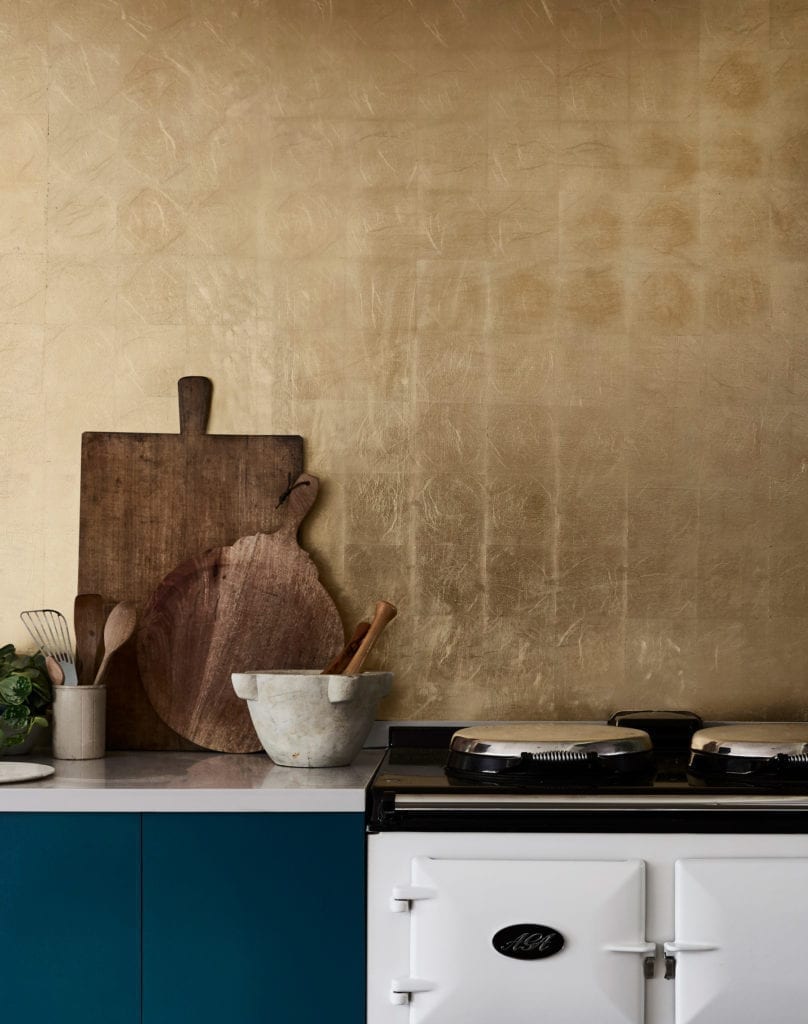 Kitchen painted with Chalk Paint in Aubusson Blue and gilded splashback in Brass Transfer Leaf