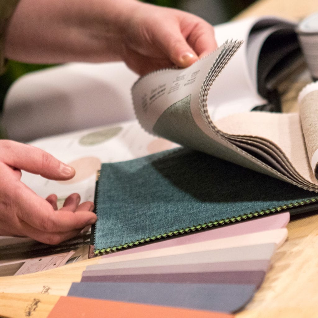 Annie Sloan Stockist flicking through fabric and paint. Lara Roberts of Plant and Paint Hull