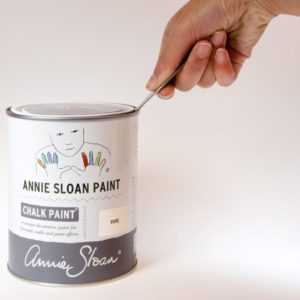 The Annie Sloan Tin Opener being used to open a tin of Chalk Paint® in Pure