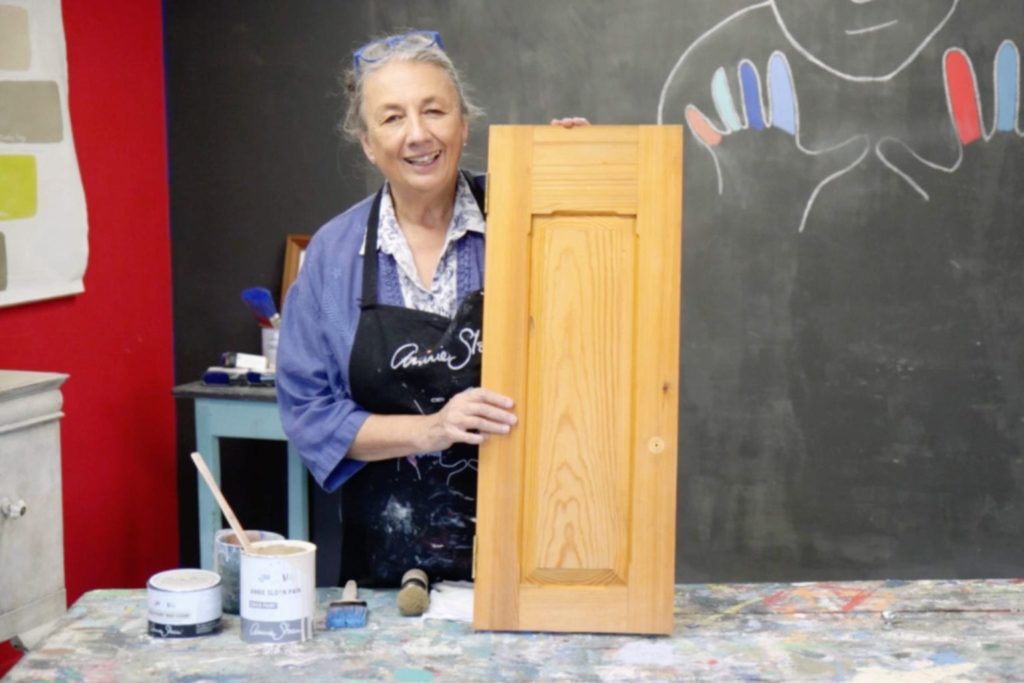 Annie Sloan painting kitchen cabinets with Chalk Paint® furniture paint in Old Ochre