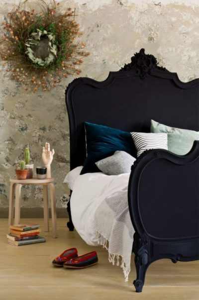 Baroque style bed painted with Chalk Paint® furniture paint by Annie Sloan in Athenian Black, in a textured neutral bedroom scene