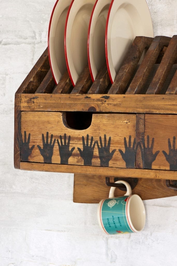 Plate rack stained and stencilled with Graphite and Hands Stencil by Annie Sloan.