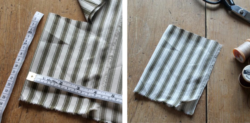 Ticking striped fabric by Annie Sloan in Olive being cut for an advent calendar pouch