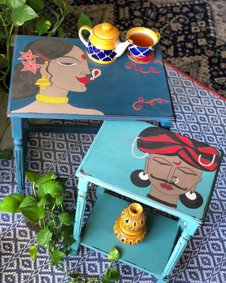 Two side tables with faces painted on them, in Chalk Paint®