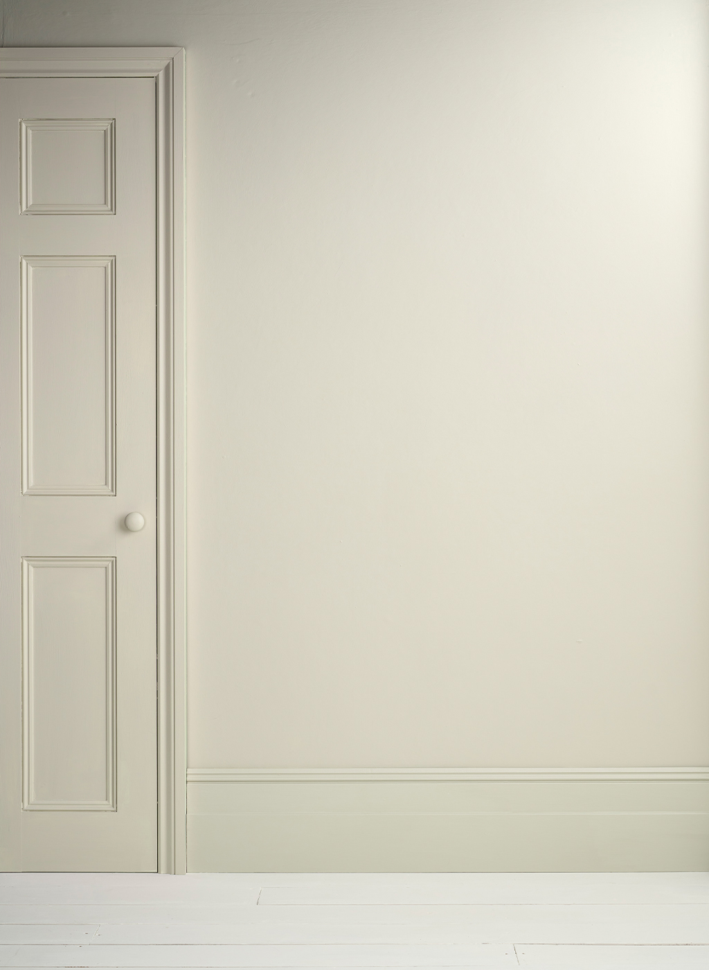 Lifestyle Image of Annie Sloan Satin Paint in Cotswold Green used on door and skirting