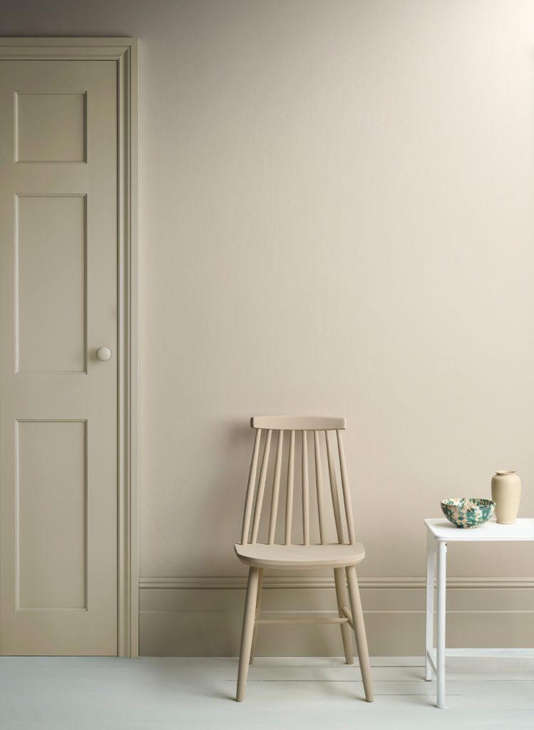 Lifestyle Image of Annie Sloan Satin Paint in Canvas featuring painted door and skirting