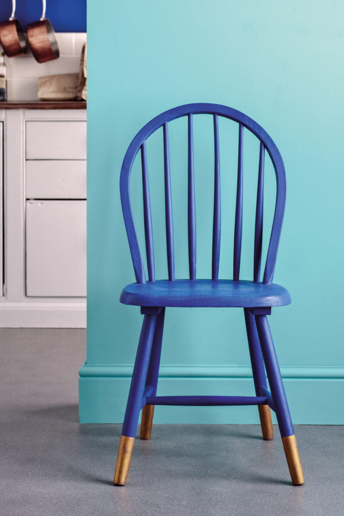 Annie Sloan Chalk Painted Chair in Napoleonic Blue against an Annie Sloan Provence Wall Paint Background