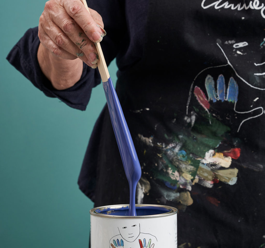 Annie Sloan Hand Stirring Napoleonic Blue Chalk Paint Close Up