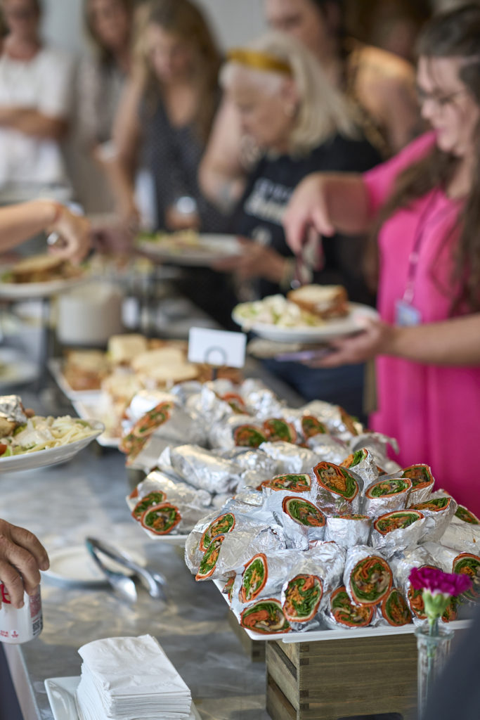 Guests choosing their lunch at the Big Paint event in New Orleans, hosted by NOCHI