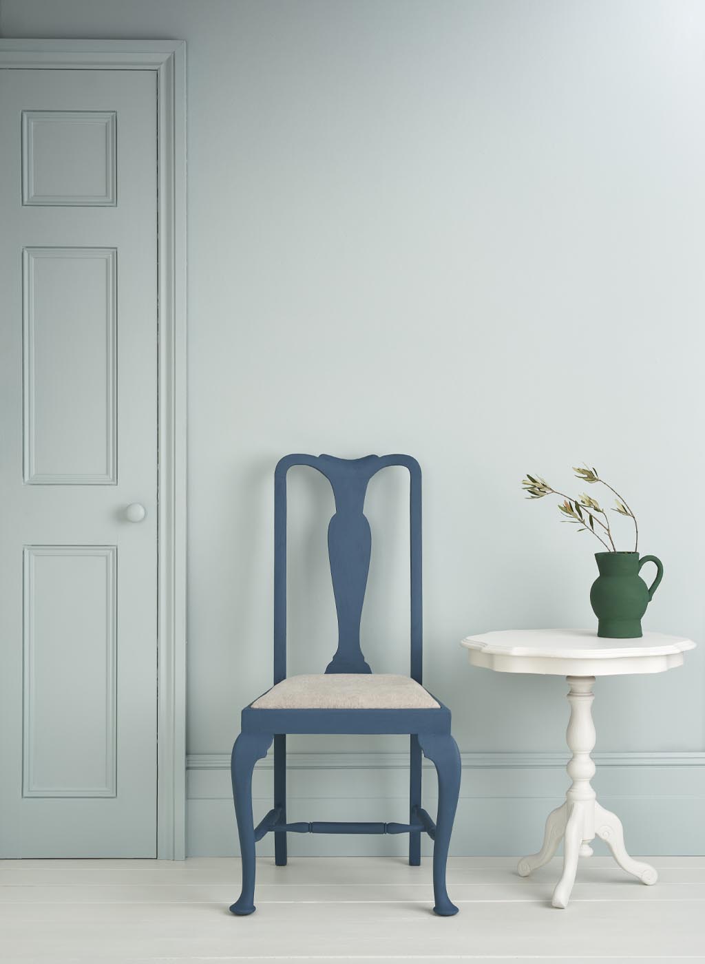 Upstate Blue Painted Wall and Satin Painted Door and Skirting Boards. Chair and Side Table Staging