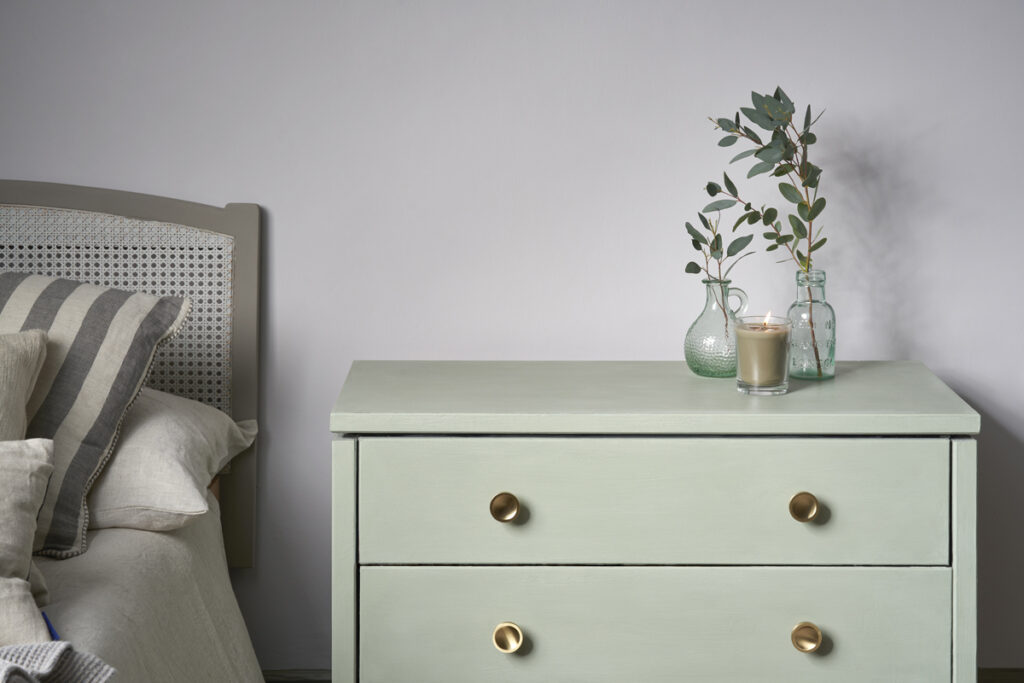 Close Up Lifestyle Image of Coolabah Green Chalk Painted Chest of Drawers in Minimal, Contemporary Bedroom