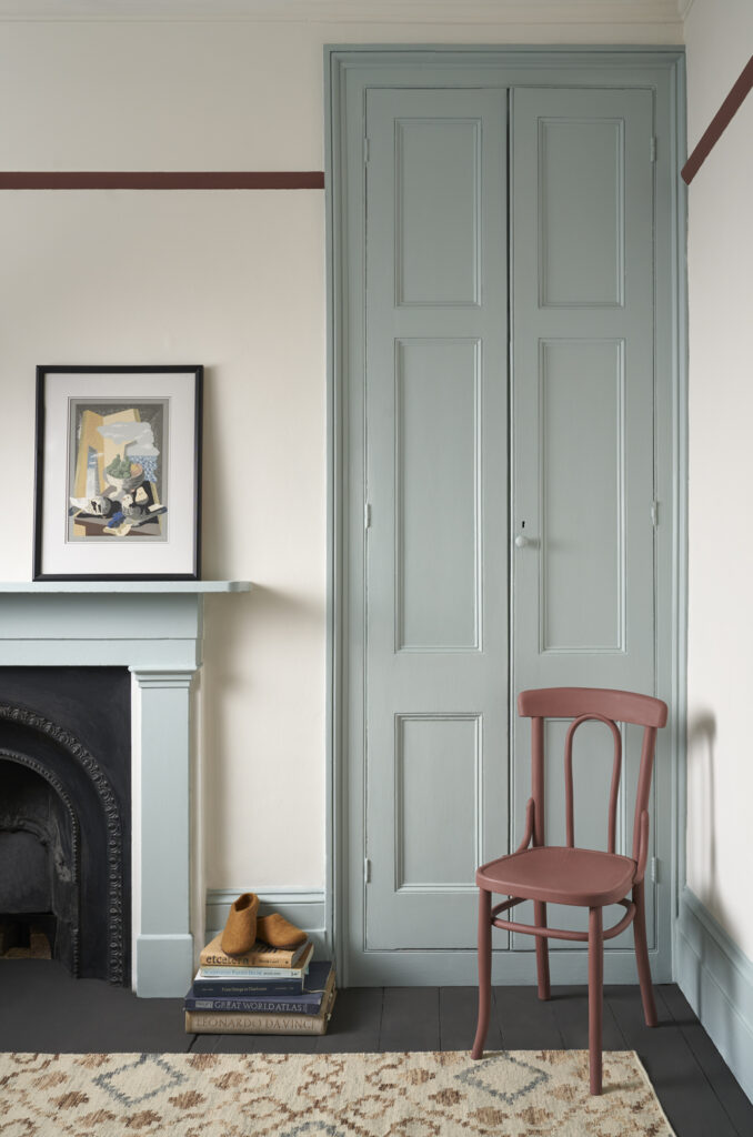 Living Room Featuring Satin Painted Cupboard Doors and Fireplace in Annie Sloan Upstate Blue and Primer Red Chair Staging