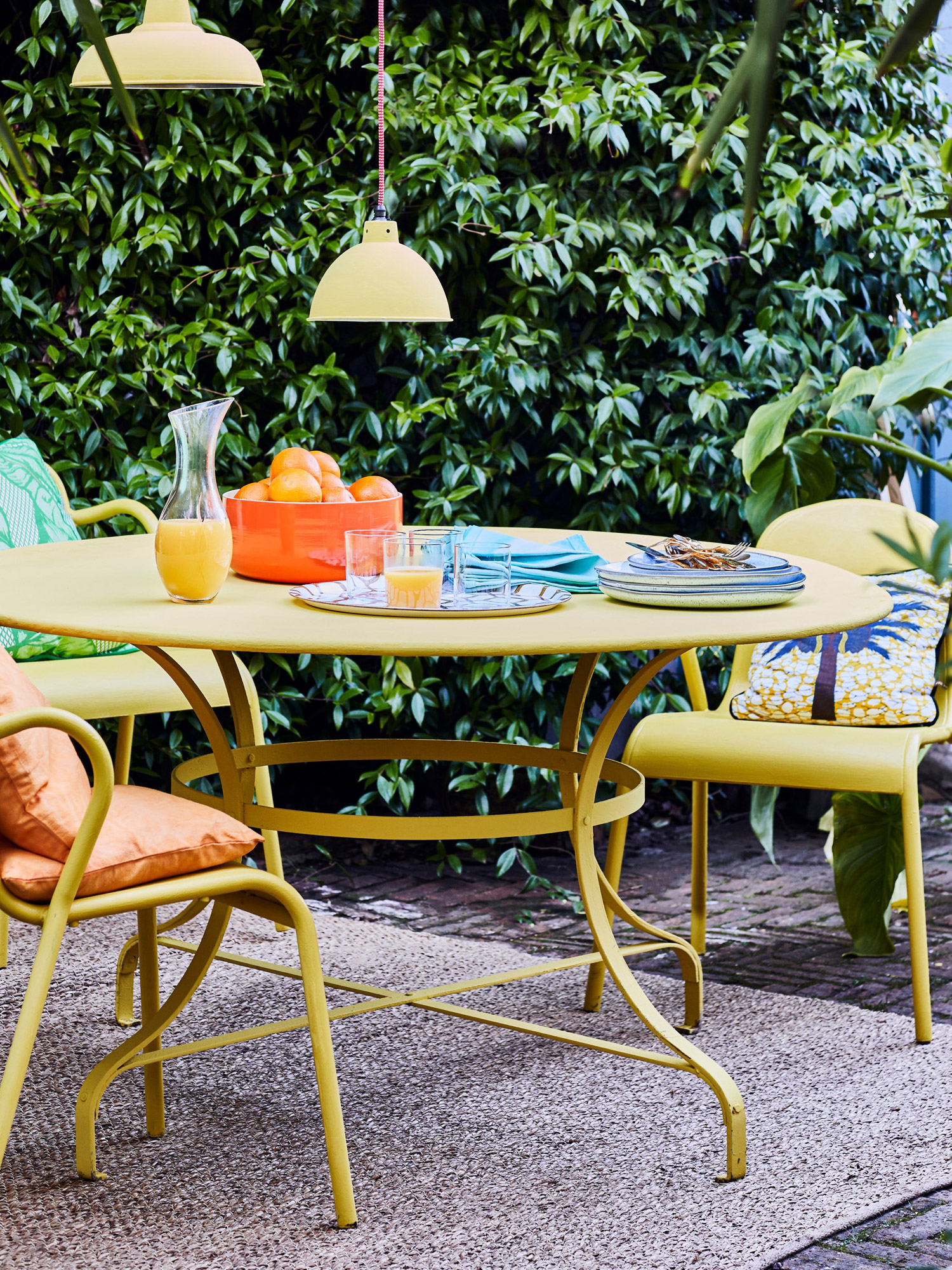 Outdoor table and chairs painted in English Yellow Chalk Paint by Annie Sloan