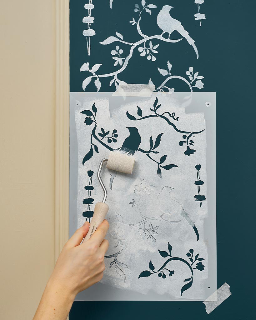 Painting the stencil design over the Old White