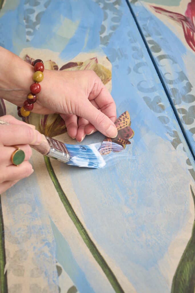 Image Medium Being Applied to Winged Wildlife Decoupage Paper Close Up