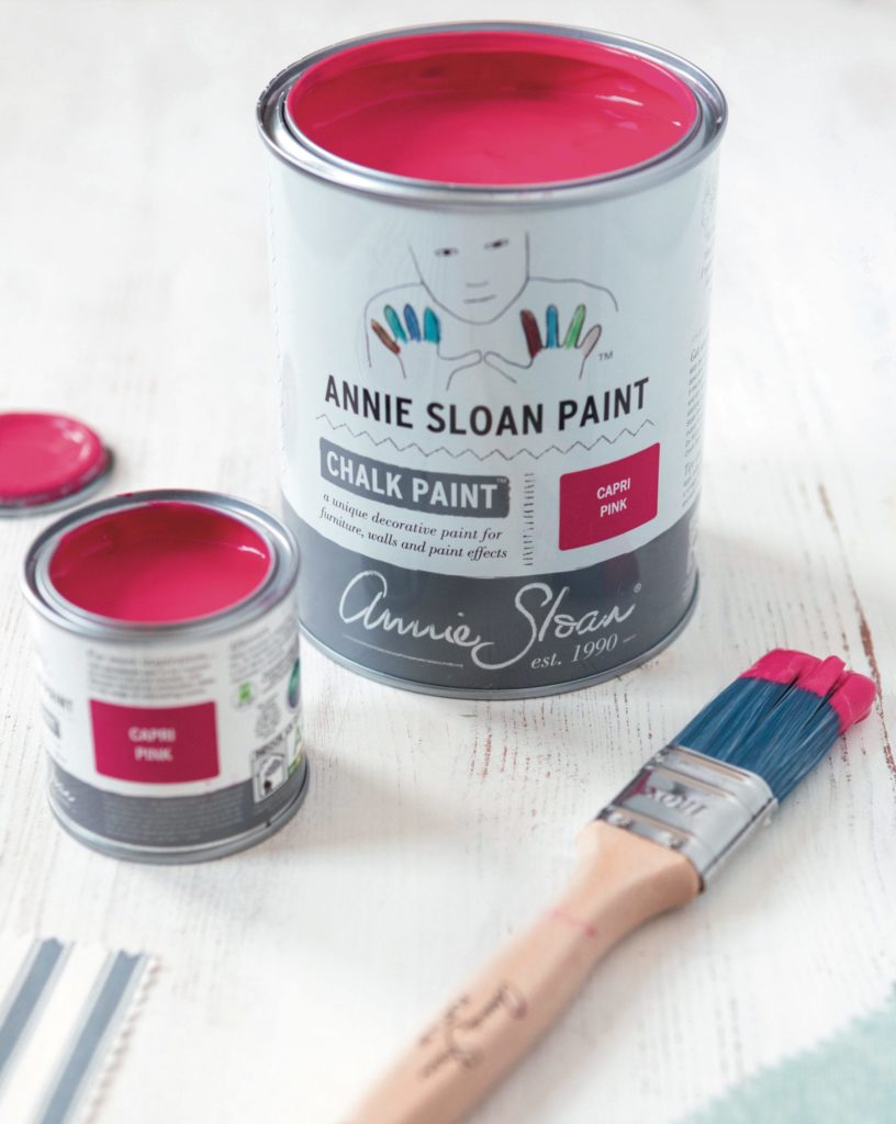 1 litre and 120ml tins of Capri Pink Chalk Paint® furniture paint by Annie Sloan, a bright, hot pink, flatly with fabric by Annie Sloan swatches