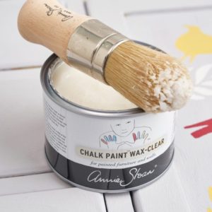 Chalk Paint Wax Brush and 500ml Clear Wax tin on a cupboard painted with Chalk Paint® by Annie Sloan in Chicago Grey