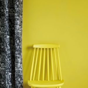 English Yellow Wall Paint by Annie Sloan, chair painted with Chalk Paint® in English Yellow and Tacit in Graphite curtain