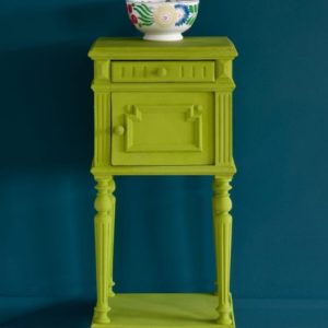 Side table painted with Chalk Paint® in Firle, a fresh, zesty and crisp green made in collaboration with Charleston Farmhouse. Against a wall of Aubusson Blue