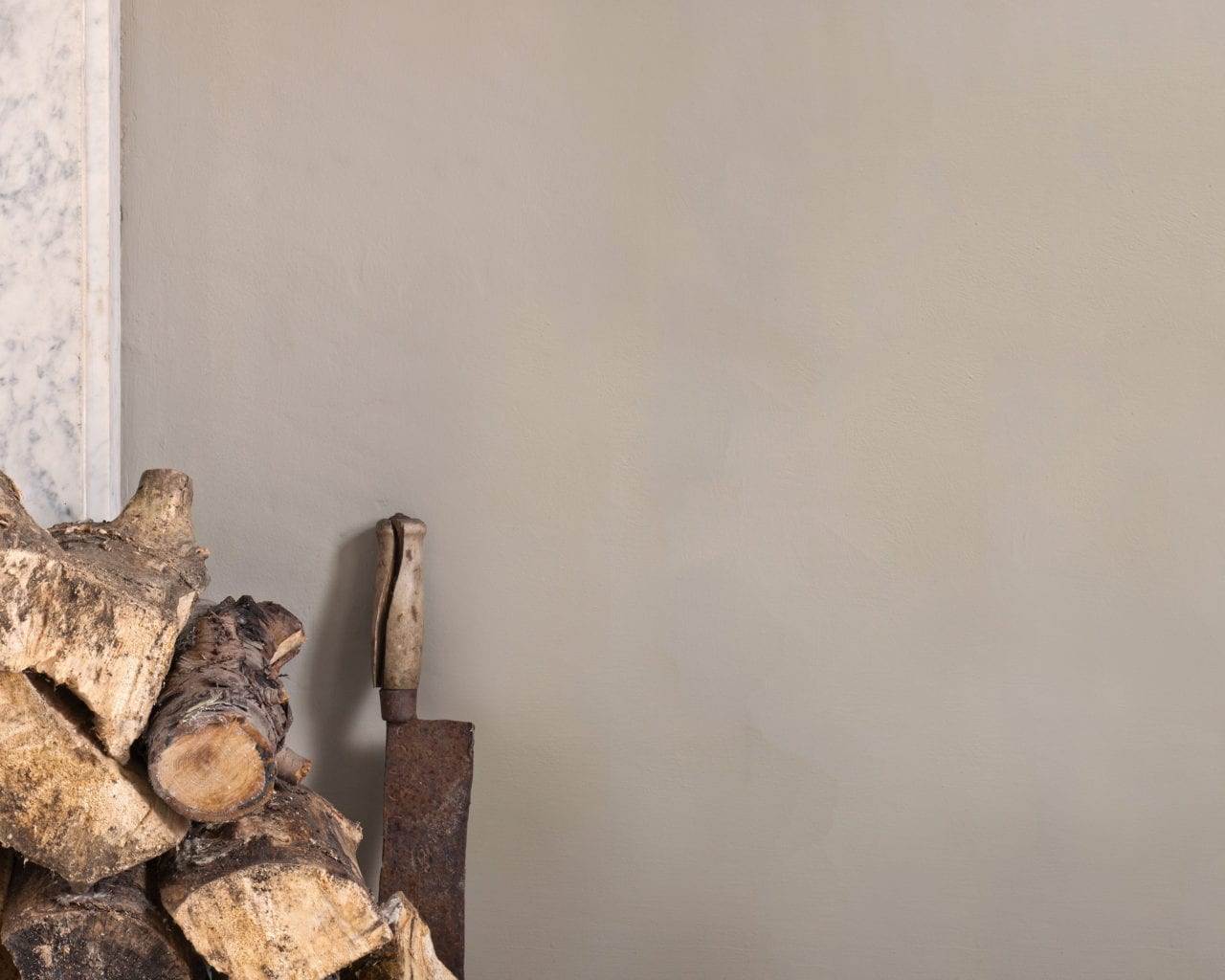 Fireplace wall painted with Wall Paint by Annie Sloan in French Linen, a cool neutral khaki grey beige