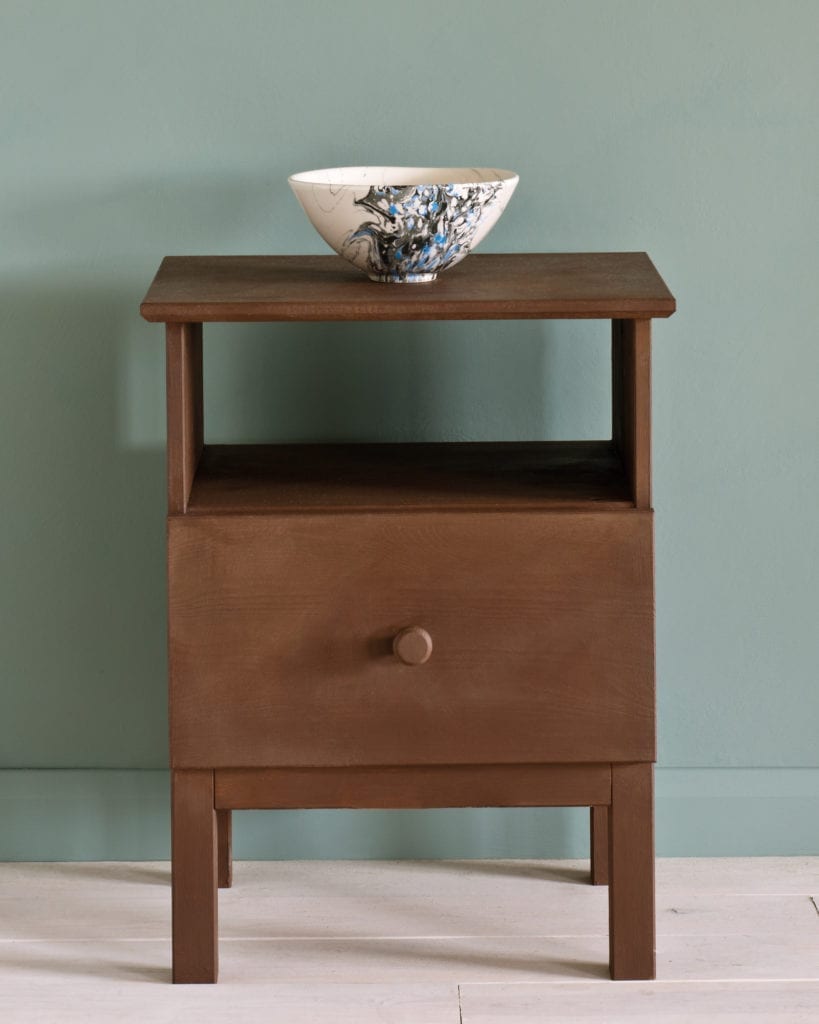 Side table painted with Chalk Paint® in Honfleur, a rich brown against a Duck Egg Blue wall