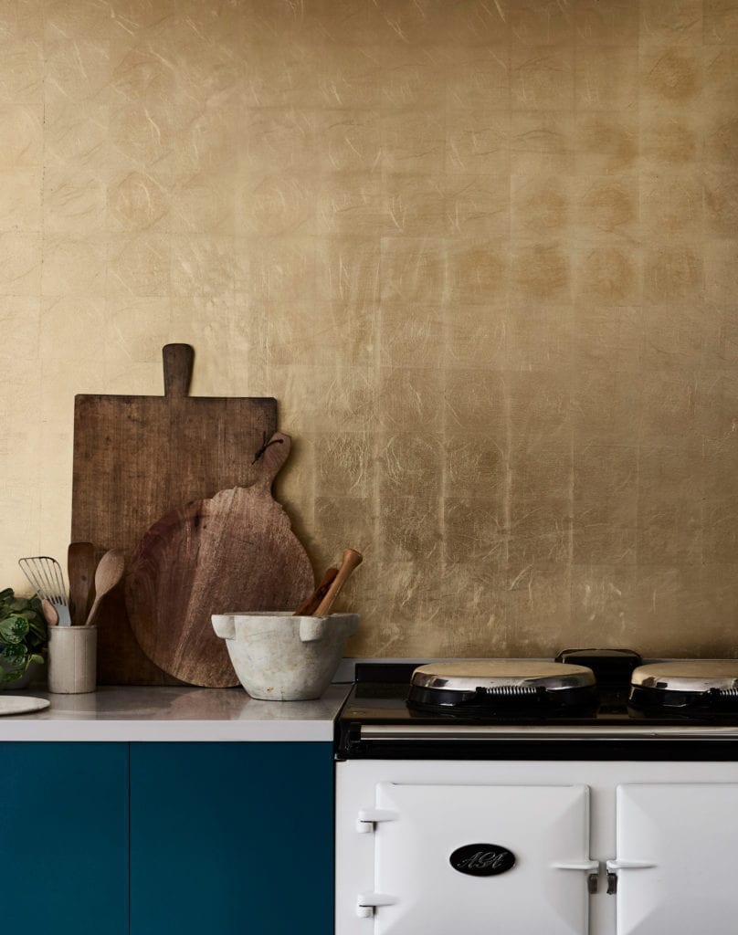 Kitchen painted with Chalk Paint in Aubusson Blue and gilded splashback in Brass Transfer Leaf
