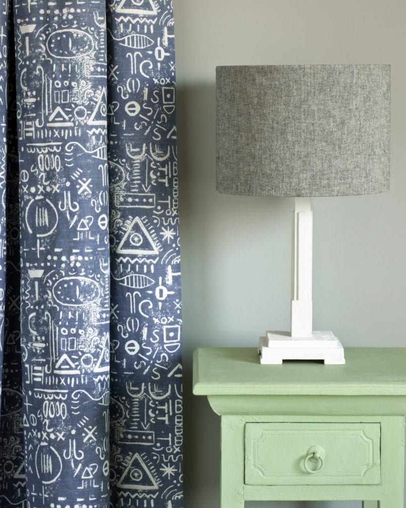 Side table painted with Chalk Paint® in Lem Lem, a soft, warm bright green colour created in collaboration with Oxfam. Tacit in Old Violet curtain and Linen Union in Graphite + Old White