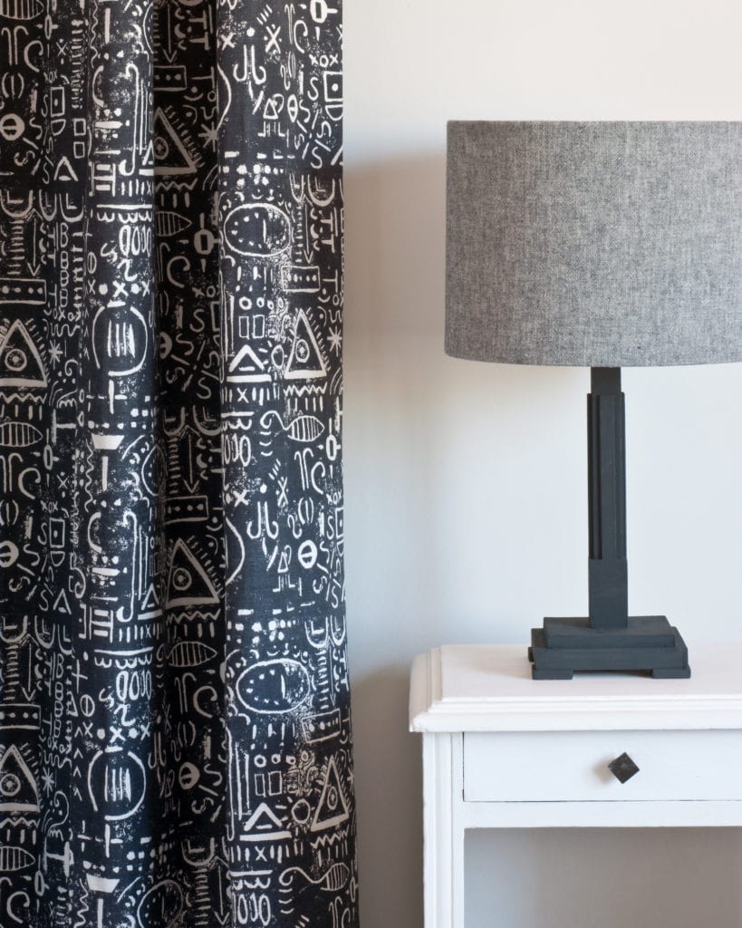 Side table painted with Chalk Paint® by Annie Sloan in Pure, curtain made from Tacit in Graphite, lampshade made from Linen Union in Graphite + Old White