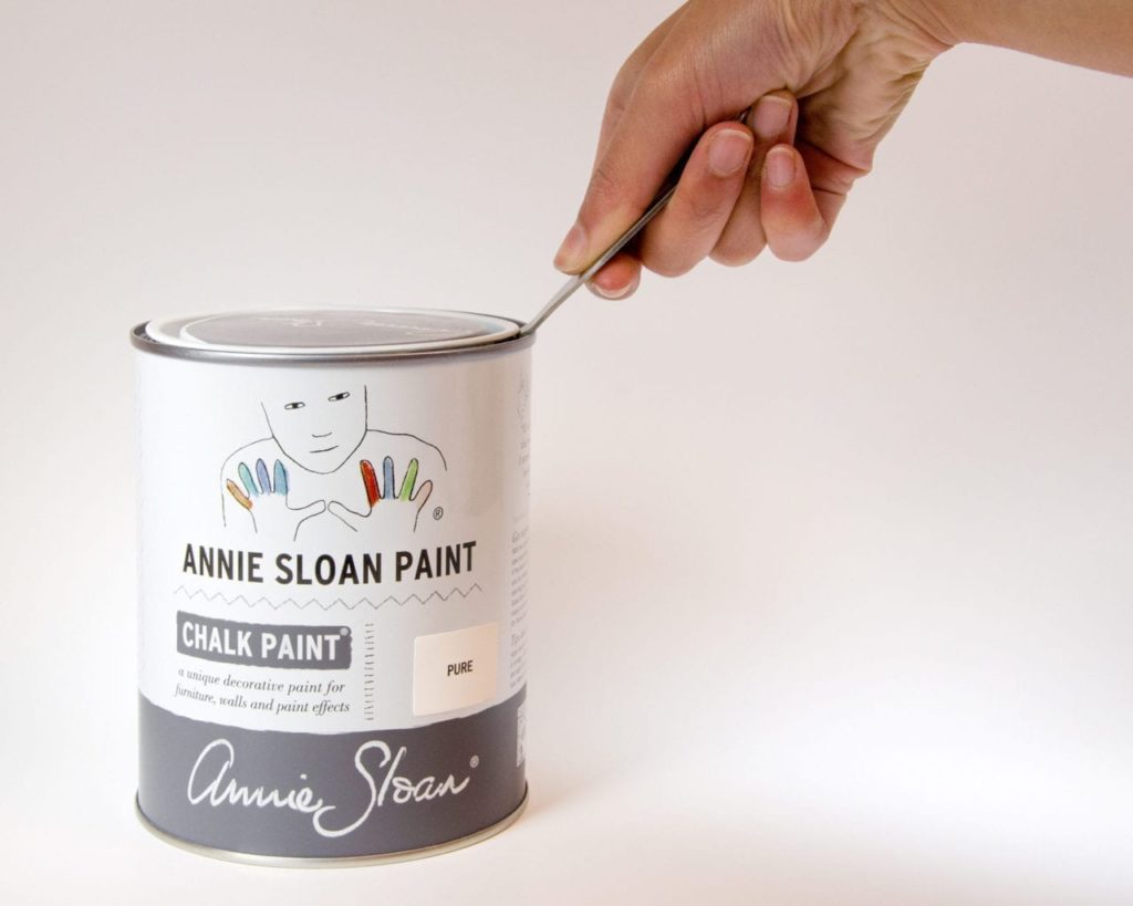 The Annie Sloan Tin Opener being used to open a tin of Chalk Paint® in Pure